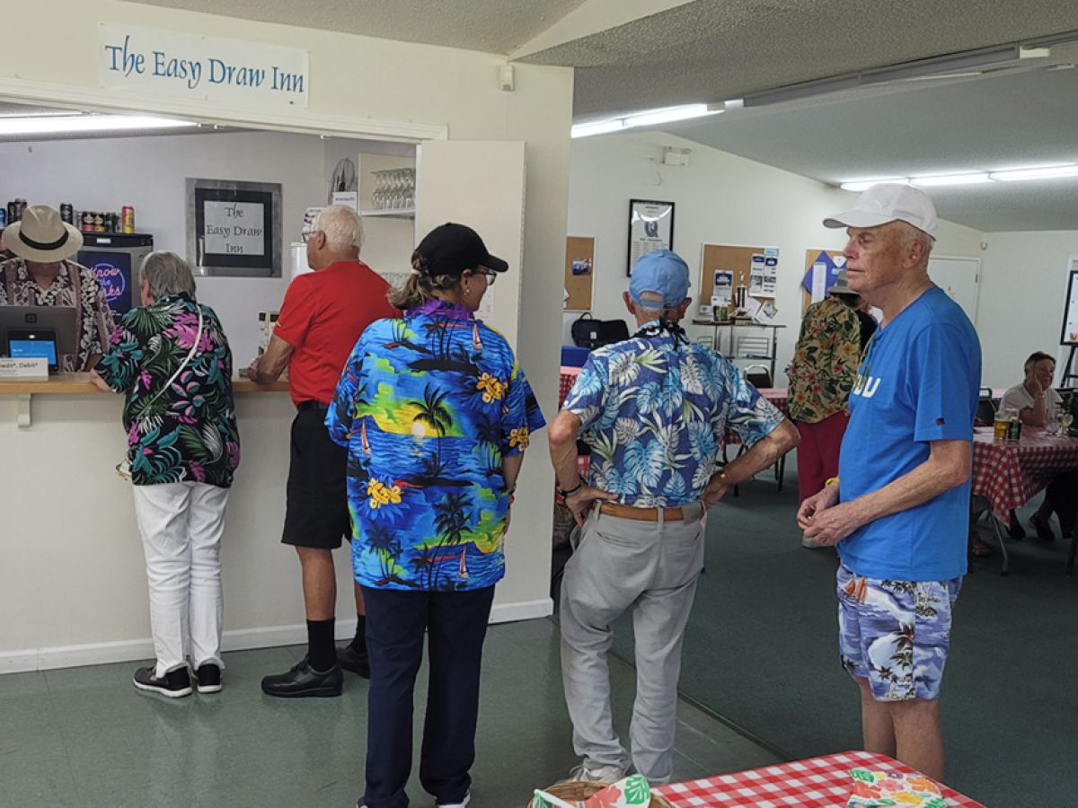 Lining up indoors on Hawaiian Day